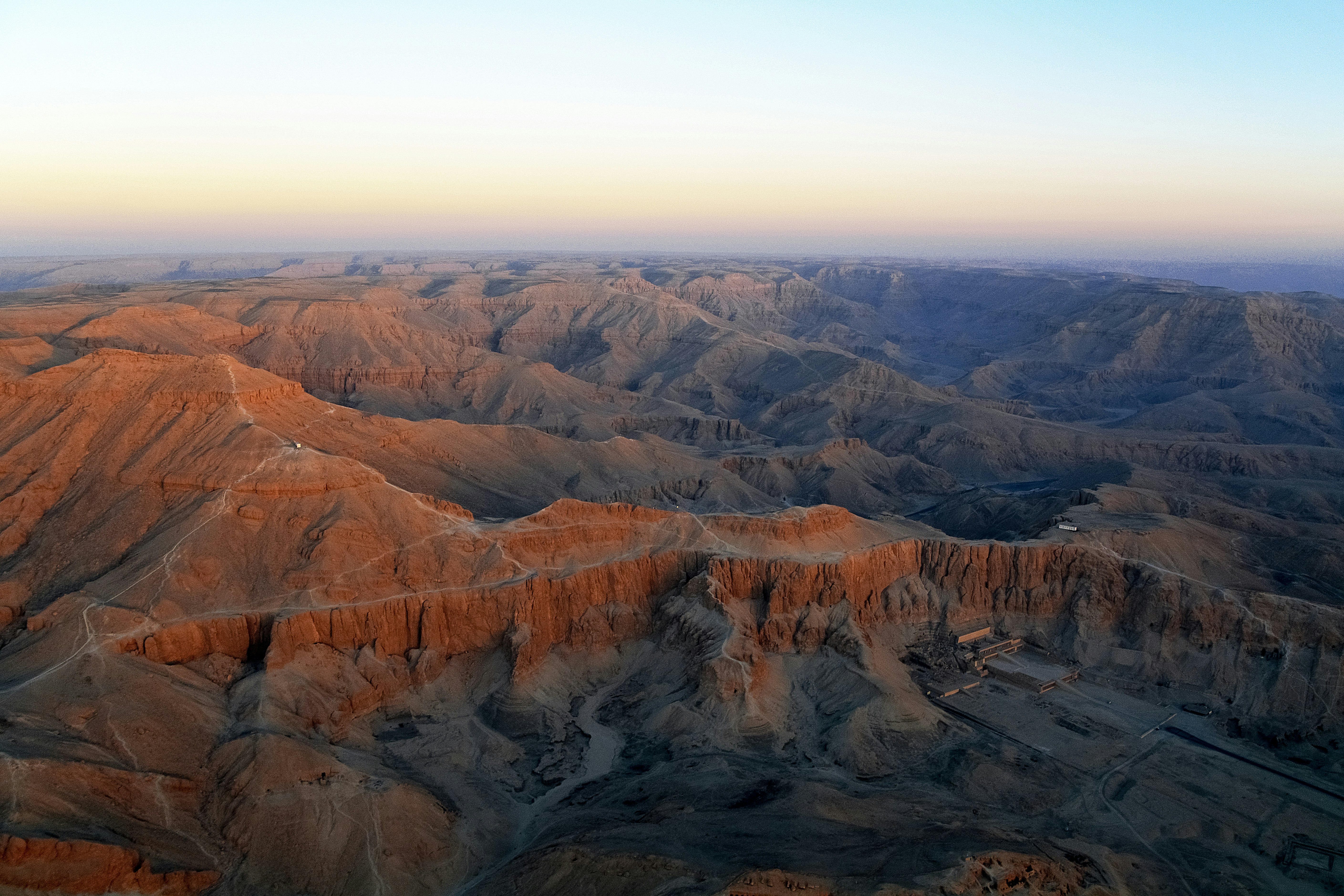 brown and gray mountains under white sky during daytime